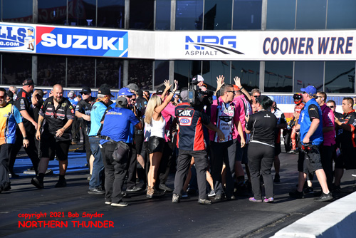 Greg Anderson & Erica Enders crew at starting 
line